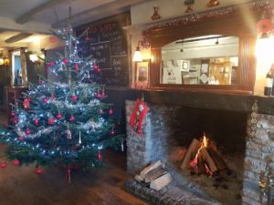 christmas fireplace and christmas tree at The White Hart pub Iron Acton